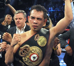 Nonito Donaire of the Philippines celebrates his win against Simpiwe Vetyeka of South Africa after their WBA featherweight title boxing fight in Macau, China. AFP PHOTO