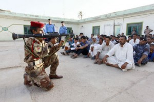 Iraqi Shiite men take part in a training session at a police station on Thursday in the Iraqi town of Shaalan, 30 kilometers south of the Shrine city of Najaf, as they volunteered to help combat a sweeping Sunni militant offensive. AFP PHOTO