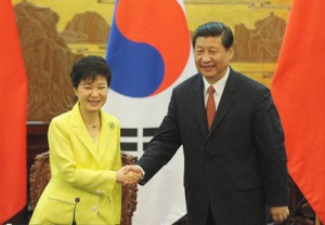 South Korean President Park Geun-Hye (left) shakes hands with Chinese President Xi Jinping after a joint declaration ceremony at the Great Hall of the People in Beijing. AFP PHOTO