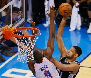 Tim Duncan No. 21 of the San Antonio Spurs shoots over Serge Ibaka No. 9 of the Oklahoma City Thunder in the second half during Game Six of the Western Conference Finals of the 2014 NBA Playoffs at Chesapeake Energy Arena in Oklahoma City, Oklahoma. AFP PHOTO