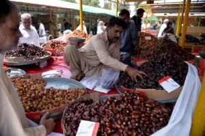 A Pakistani vendor sells dates at a weekly bazaar ahead of the Islamic holy month of Ramadan in Islamabad on Sunday. AFP PHOTO