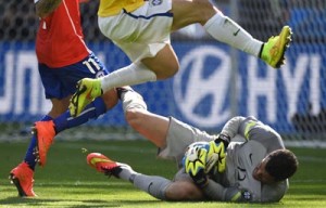 Brazil’s goalkeeper Julio Cesar makes a save during the round of 16 football match between Brazil and Chile at The Mineirao Stadium in Belo Horizonte during the 2014 FIFA World Cup. AFP PHOTO