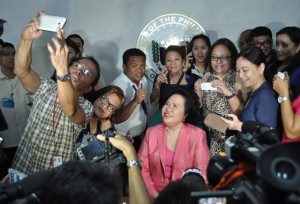 Upbeat after revealing she has lung cancer, Sen. Miriam Defensor Santiago gamely poses with reporters for pictures after her press conference on Wednesday. The senator said she will undergo chemotheraphy soon.Photo by Edwin Muli