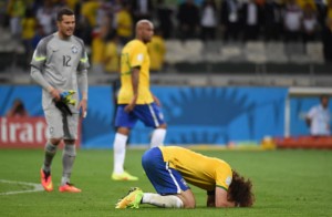 Brazil’s defender David Luiz is crestfallen after the humiliating defeat inflicted by Germany at the Mineirao Stadium in Belo Horizonte on Tuesday.  AFP PHOTO 