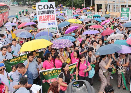 Hundreds of Quezon City public school teachers gather in front of City Hall on Thursday to press their demand for teachers local allowance and the immediate passage of House Bill 245 that would raise their salary.  Photo By Ruy L. Martinez 