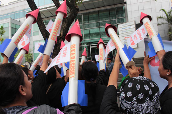  Members of the Di Ka Pasisikil Movement aim paper missiles at the Chinese Embassy in Makati City to dramatize their protest against Chinese aggression on Thursday. PHOTO BY RUY L. MARTINEZ 