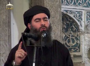 An image grab taken from a propaganda video released on Saturday by al-Furqan Media allegedly shows the leader of the Islamic State jihadist group, Abu Bakr al-Baghdadi, also known as Caliph Ibrahim, adressing Muslim worshippers at a mosque in the militant-held northern Iraqi city of Mosul. Baghdadi, who on June 29 proclaimed a “caliphate” straddling Syria and Iraq, purportedly ordered all Muslims to obey him in the video released on social media. AFP PHOTO