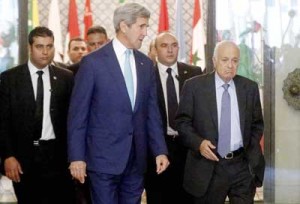 US Secretary of State John Kerry (center) and Arab League chief Nabil al-Arabi (right) arrive for a meeting in the Egyptian capital Cairo on Tuesday. Kerry has returned to the Middle East as the administration of US President Barack Obama attempts to bolster regional efforts to reach a ceasefire and sharpens its criticism of Hamas in its conflict with Israel. AFP PHOTO