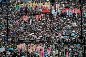 Demonstrators gather before a pro-democracy rally seeking greater democracy in Hong Kong on Tuesday as frustration grows over the influence of Beijing on the city. AFP PHOTO