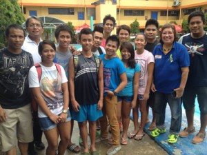 Philippine Swimming League President Susan Papa, Technical Committee Head Ed Mascardo, and JB Lacson swimming team Head Coach Ronald Sta. Ana and assistant coach Hans Aplaon with some of the swimmers who qualified for the 2015 World Summer University Games in Gwangju, South Korea. CONTRIBUTED PHOTO