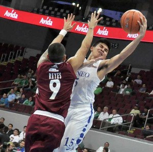 Ateneo’s Kiefer Ravena (No. 15) scores a layup against University of the Philippines’ Miguel Reyes (No. 9) during their match on Wednesday in the University Athletic Association of the Philippines Season 77 men’s basketball tournament at the Mall of Asia Arena in Pasay City. CONTRIBUTED PHOTO