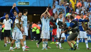 Sao Paulo: Argentina’s forward and captain Lionel Messi (center) and his teammates celebrate ATthe end of a Round of 16 football match between Argentina and Switzerland at Corinthians Arena in Sao Paulo during the 2014 FIFA World Cup.AFP PHOTO 