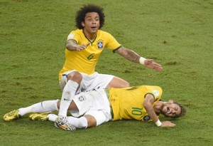 Defender Marcelo shouts for help after Brazil’s forward Neymar was injured during the quarterfinals football match between Brazil and Colombia at the Castelao Stadium in Fortaleza during the 2014 FIFA World Cup. AFP PHOTO