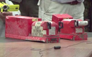 This image grab taken from an Agence France-Presse TV video shows the two black boxes recovered from the crash site of the MH17 jet being handed over to Malaysian officials during a press conference in Donetsk on Tuesday. AFP PHOTO