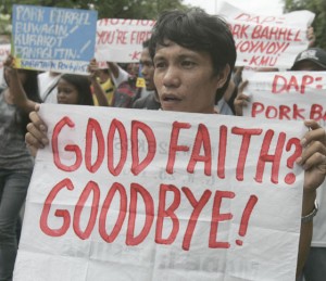 Militants stage a lighting protest near Malacañang on Monday, to call for the prosecution of President Benigno Aquino 3rd and Budget Secretary Butch Abad over the Disbursement Acceleration Program, some parts of which were declared unconstitutional by the Supreme Court. PHOTO BY RENE DILAN