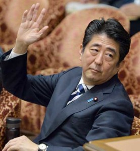 Japanese Prime Minister Sinzo Abe raises his hand to answer a question of an opposition lawmaker at the Lower House’s budget committee session at the National Diet in Tokyo on Monday. Abe called for talks with Chinese President Xi Jinping during a regional meeting in Beijing in November, the latest call from Tokyo for a face-to-face meeting amid testy diplomatic relations. AFP PHOTO
