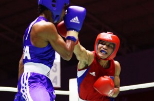 Charly Suarez (right) scores a right cross against a foe. FILE PHOTO