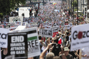 Demonstrators march through the streets from outside the Israeli embassy in central London on Sunday, calling for an end to violence in Gaza. At least 10,000 pro-Palestinian protesters opposed to Israel’s military action in Gaza marched through central London for the second week running on Sunday. AFP PHOTO