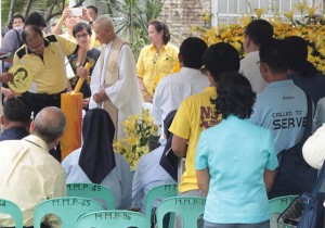 President Aquino lights a candle in a Mass during the commemoration of the fifth death anniversary of former Presi– dent Corazon Aquino at the Manila Memorial Park in Sucat, Parañaque City (Metro Manila), on Friday.  PHOTO BY RUY L. MARTINEZ