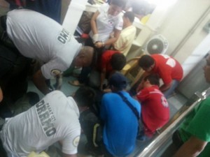 Red Cross personnel attend to a passenger who was injured when a Metro Rail Transit train crashed into a barrier at the Taft station on Wednesday. Some of the injured passengers had to be taken to the San Juan De Dios Hospital and Pasay City General Hospital. CONTRIBUTED PHOTO
