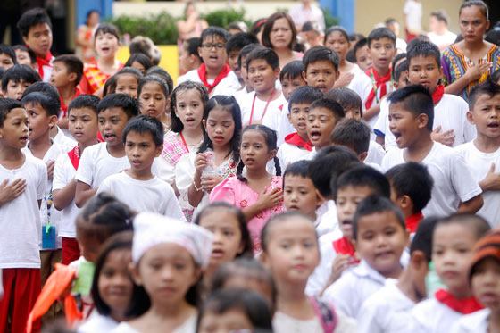 Students from Francisco Legaspi Memorial Elementary School in Pasig City attend a flag-raising ceremony wearing Filipiniana costumes to celebrate Buwan ng Wikang Pambansa (National Language Month) on Wednesday. PHOTO BY MIGUEL DE GUZMAN 