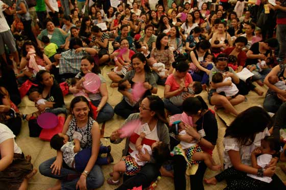 CAMPAIGN FOR BREASTFEEDING Hundreds of mothers breastfeed their babies on Saturday at the Philippine Army clubhouse in Fort Bonifacio in Taguig City. Simultaneous breastfeeding activities were held yesterday to mark National Breastfeeding Awareness Month. PHOTO BY RENE H. DILAN