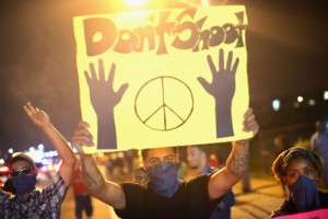 Demonstrators hold up a “don’t shoot” sign during a protest staged on Monday over the killing of teenager Michael Brown in Ferguson, Missouri. Despite the Brown family’s continued call for peaceful demonstrations, violent protests have erupted nearly every night in Ferguson since his death. AFP PHOTO