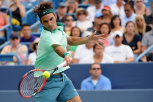 Roger Federer of Switzerland returns to David Ferrer of Spain during a final match on day 9 of the Western & Southern Open at the Linder Family Tennis Center in Cincinnati, Ohio. AFP PHOTO