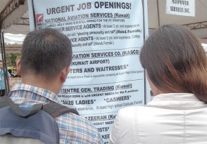 Jobseekers look for employment openings at a recent job fair in Manila. The SWS survey results showed an unemployment rate of 25.9 percent, equivalent to an estimated 11.8 million adults. PHOTO BY EDWIN MULI