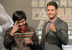 Philippine boxing icon Manny Pacquiao (left) and American Chris Algieri pose for photographs during a prefight press conference in Macau. Pacquiao will take on Algieri in a World Boxing Organization (WBO) welterweight title fight in Macau on November 23. AFP PHOTO