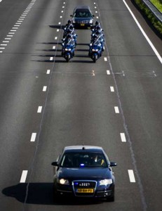 A hearse carrying a coffin with human remains collected over the last couple of days at the crash site of flight MH17 in Ukraine is escorted over the highway in Hilversum to the base where the remains are investigated in Hilversum, the Netherlands, on Tuesday. AFP PHOTO