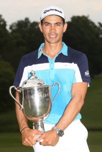 Camilo Villegas of Colombia poses with the Sam Snead Cup after winning the Wyndham Championship at Sedgefield Country Club in Greensboro, North Carolina. AFP PHOTO