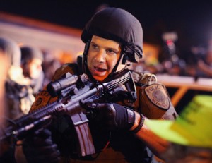 Police charge into the media work area with rifles at ready as they try to control demonstrators protesting the killing of teenager Michael Brown on Wednesday in Ferguson, Missouri. Despite the Brown family’s continued call for peaceful demonstrations, violent protests have erupted nearly every night in Ferguson since his death. AFP PHOTO