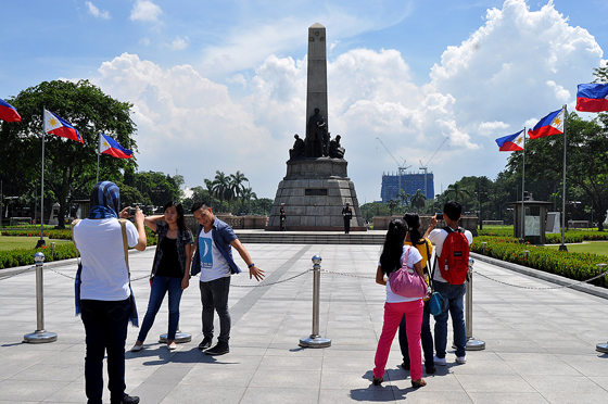 Local and foreign tourists stroll and take photos near the monument of National Hero Dr. Jose Rizal in Manila’s Rizal Park (Luneta) on Sunday. National Heroes' Day is celebrated every fourth Monday of August to pay homage to the country’s heroes as well as to all other known or unknown men and women who sacrificed their lives for Philippine freedom. PHOTO BY EDWIN MULI