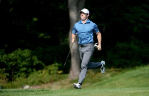 Rory McIlroy of Northern Ireland runs down to the par 3 green during the pro am event prior to The Barclay1s at The Ridgewood Country Club in Paramus, New Jersey. AFP PHOTO