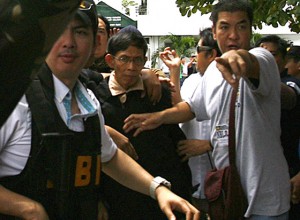 NBI agents try to cut a path for General Jovito Palparan as he is returned to the Bulacan Provincial Jail after his arraignment at the Malolos, Bulacan Regional Trial Court. Palparan is accused of kidnapping and serious illegal detention in connection with the 2006 disappearance of two University of the Philippines students. PHOTO BY MIKE DE JUAN