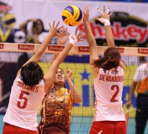 PLDT’s Gretchel Soltones and Ryzabelle Devanadera duel Wenneth Eulalio of Cagayan Valley on the net during their Shakey’s V-League Season 11 Open Conference quarterfinal showdown at The Arena.