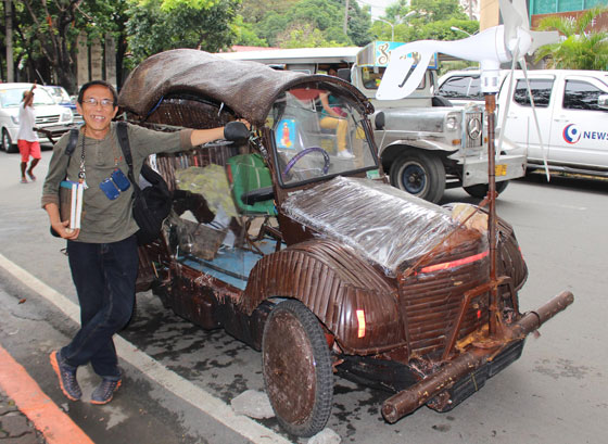 Prof. Benjamin Mangubat poses alongside his invention, an environment-friendly car made of bamboo he called “Bangkar-Wayans.” The battery-operated car can also run on water. PHOTO BY RUY MARTINEZ 