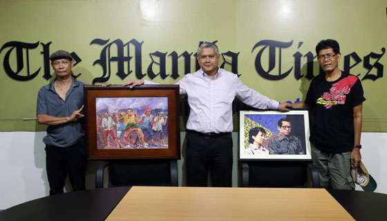 Jeffrey Consumo (left), the former art mentor of the late President Corazon Aquino, and Nolo Comoda, contributing cartoonist of Pilipino Star Ngayon, hand over on Thursday two of their works to Dante Francis Ang 2nd, executive editor of The Manila Times in appreciation of The Times’ sponsoring an art exhibit entitled Memoirs of Ninoy and Tita Cory in July. The exhibit was mounted by the Art Connect artists group. PHOTO BY RENE DILAN 