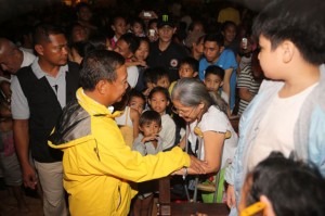 Vice President Jejomar Binay comforts flood victims who sought shelter at the Sto. Domingo Church in Quezon City. Binay visited the evacuees on Friday night as storm Mario battered communities in Metro Manila. In Baao, Camarines Sur.