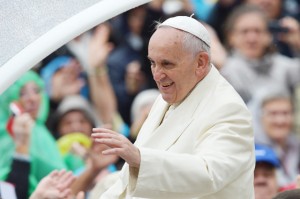 Pope Francis greets the crowd as he arrives for his general audience at St Peter’s Square on Wednesday.   AFP PHOTO 