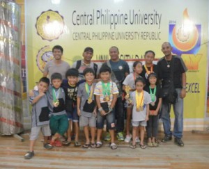 Philippine Swimming League (PSL) Western Visayas Chapter Regional Director Pepe Borres together with the Most Outstanding Swimmer awardees in the recent PSL Leg Series in Iloilo. CONTRIBUTED PHOTO
