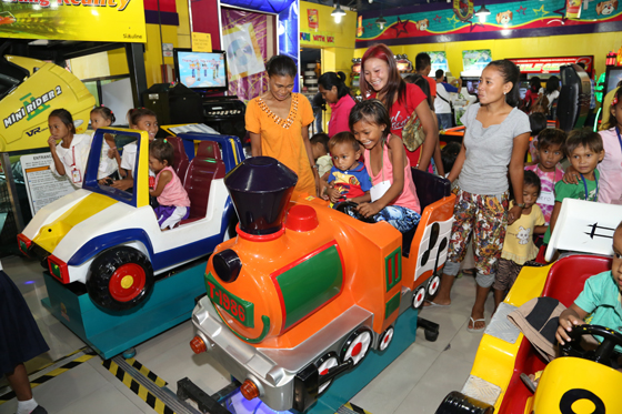 Eighty children from the Badjao community in Barangay Dalahican, Lucena City, Quezon enjoy the rides at the World of Fun Arcade in SM City-Lucena. Mall manager Maricel Alquiros supervised the treat for the children, who were accompanied by Fr. Martin Mroz, founder of Payatas Oreone Foundation a non-government organization that adopted the Badjao community. PHOTO BY BELLY M. OTORDOZ 