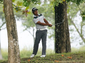 ZAnie Boy Gialon plays out of a trouble lie in the final round of the storm-hit ICTSI Royal Northwoods Championship. Contributed Photo