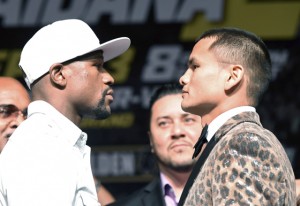 WBC/WBA welterweight champion Floyd Mayweather Jr. (left) and Marcos Maidana face off during a news conference at the MGM Grand Hotel/Casino in Las Vegas, Nevada. AFP PHOTO