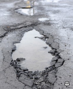 Potholes occur when water permeates the pavement—usually through a crack from wear and tear of traffic—and softens the soil beneath it, creating a depression in the surface of the street.  