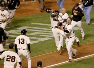 Travis Ishikawa of the San Francisco Giants celebrates after he hits a three-run walk-off home run to defeat the St. Louis Cardinals 6-3 during Game Five of the National League Championship Series, at AT&T Park in San Francisco, on October 16, 2014 Getty/AFP - Jason O. Watson