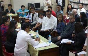 OLONGAPO HEARING:  Rowena Garcia-Flores (seated, right) counsel of US Marine Joseph Scott Pemberton, the suspect in the killing of Jeffrey “Jennifer” Laude in Olongapo City, faces a panel of prosecutors investigating the murder complaint filed against her client, who did not attend the probe. Beside her is Laude fiancé Marc Sueselbeck.  PHOTO BY RENE DILAN 