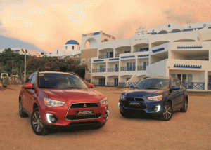 The Amazon Red and Sonic Blue variants of the ASX with the Thunderbird Resort as the back ground