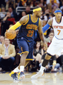 Toe-to-toe  LeBron James No.23 of the Cleveland Cavaliers handles the ball against Carmelo Anthony No.7 of the New York Knicks in the second quarter at Quicken Loans Arena on October 30, 2014  in Cleveland, Ohio.   AFP photo 